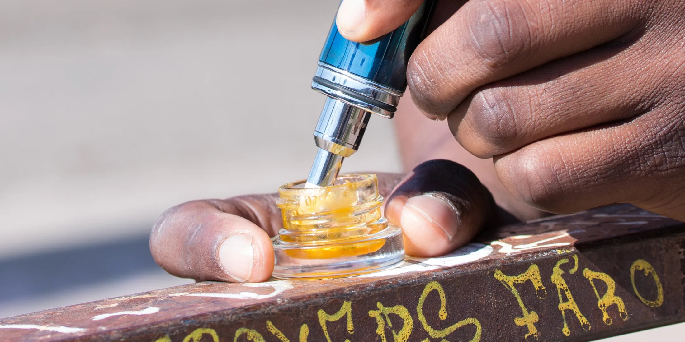 Man prepping a dab hit.