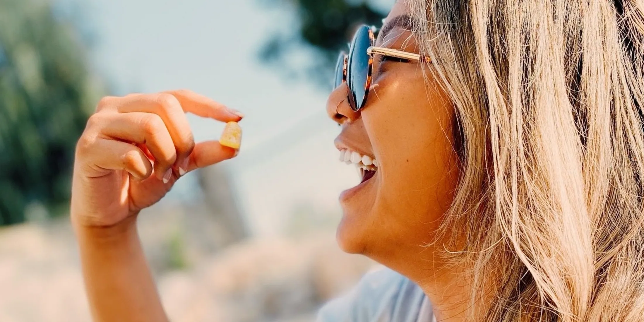 Woman eating a THC gummy edible.